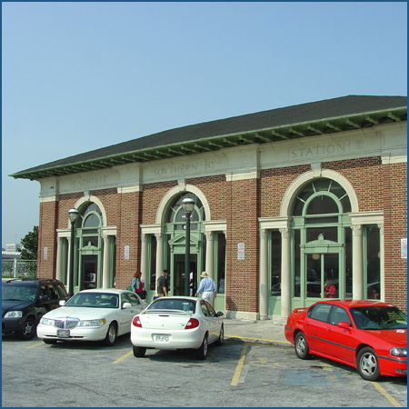The brick front of Peachtree Station, with three tall arched entrances